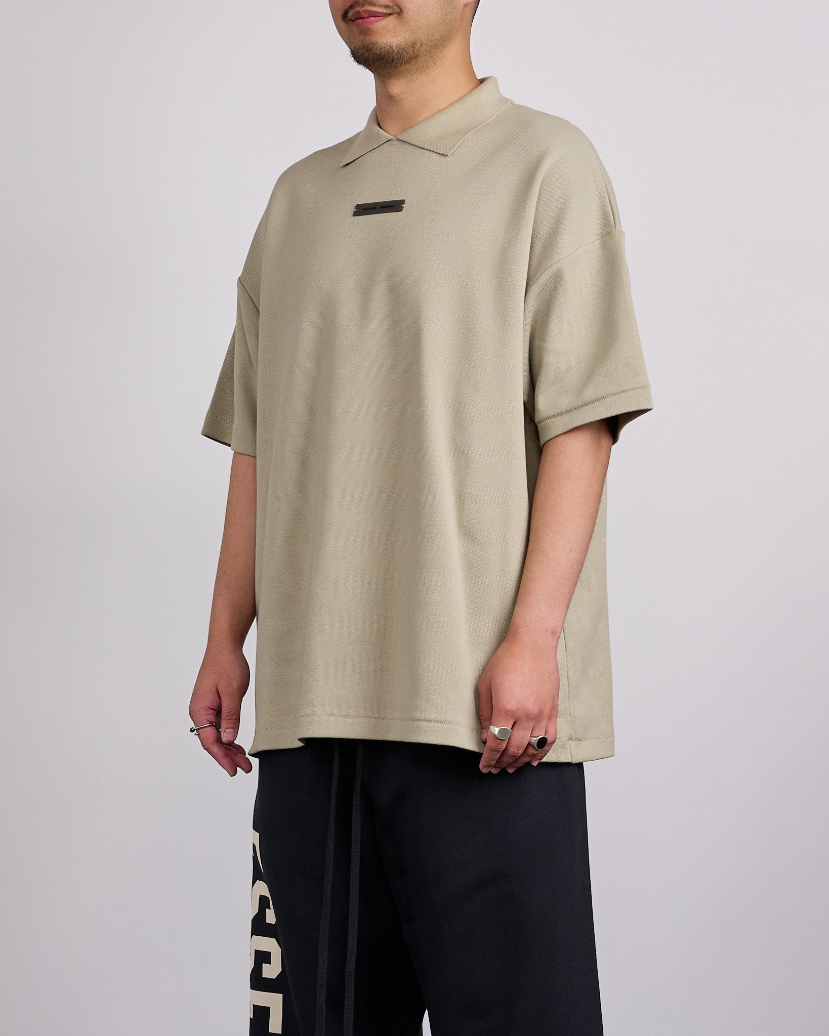 Fear of God Essentials 90's Fit Pique Polo Shirt Abbey Stone – LESS 17
