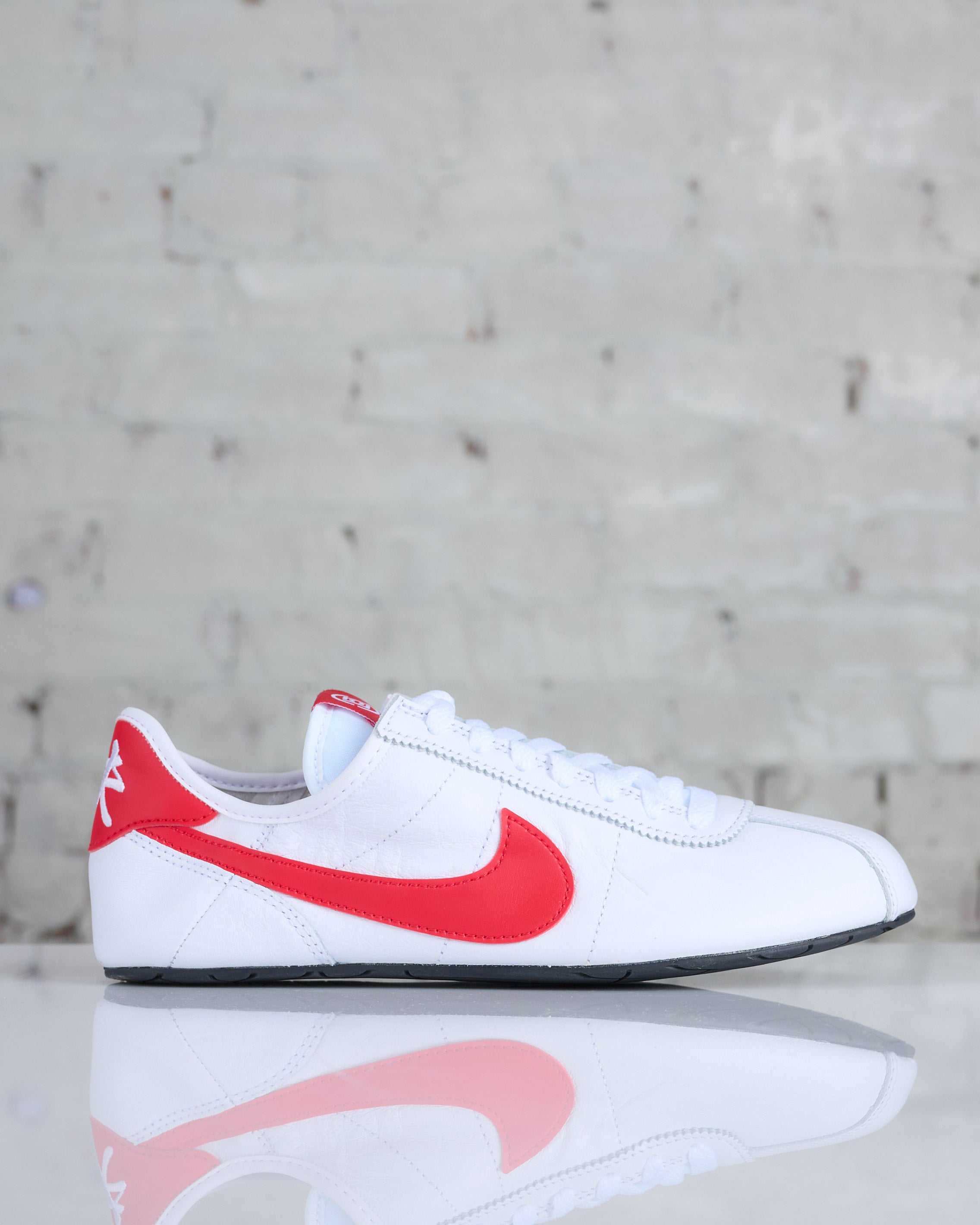 Cortez leather trainers in white with red outlet swoosh